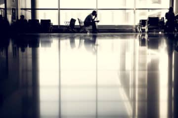 Man waiting in a waiting area.