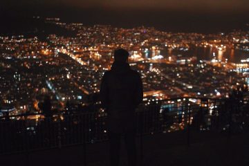 Man overlooking city.