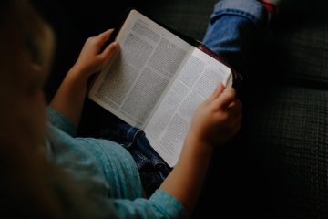 Person reading bible.