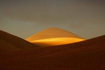 Hill highlighted by sun.
